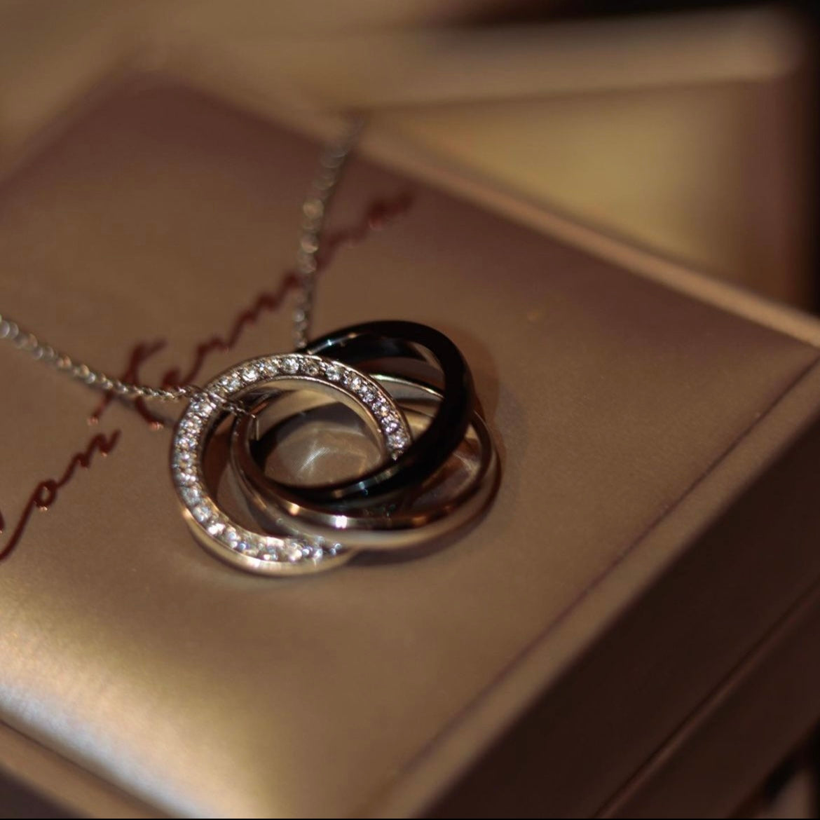 Tied | the fusion of three different rings - Black and Silver/ White and Rose Gold